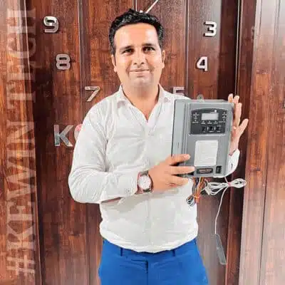 e1776736-1ac4-4d6c-83ff-445144aceb61 Sunil Tholia (Managing Director ) holding Kewintech GSM pump controller for agriculture automation